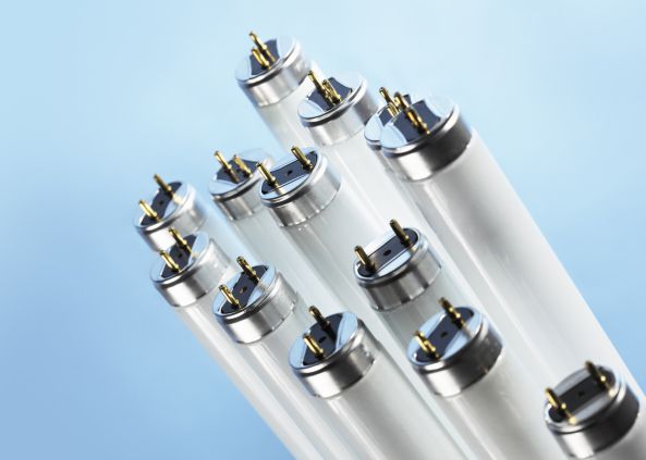 New fluorescent light tubes on blue background