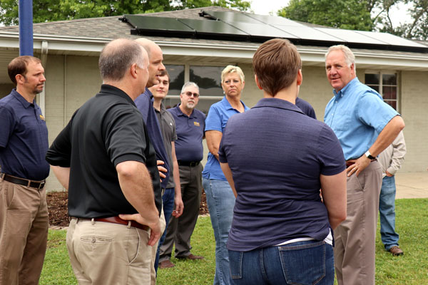 John Shimkus talks with Tick Tock Energy staff