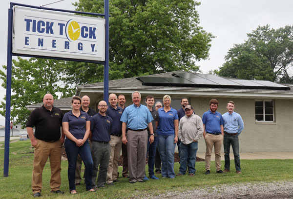 John Shimkus poses with Tick Tock Energy staff