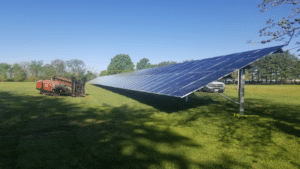 A ground mounted solar panel on a farm.