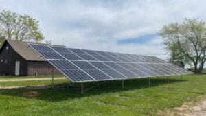 A ground-mounted solar panel system on a farm in Illinois