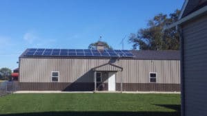 A commercial building with roof-mounted solar panels.